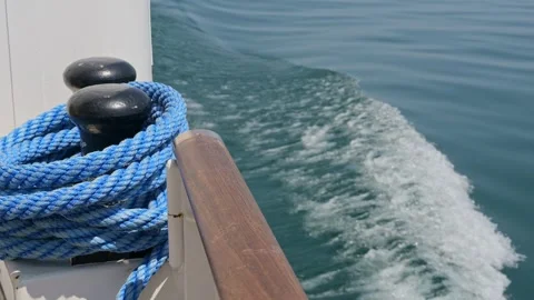 Close Up of Boat Railing and Rope Against Blue Lake Water Stock Footage 319985148