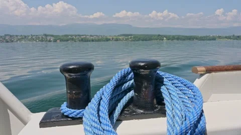 Close Up of Boat Railing and Rope Against Blue Lake Water Video stock 319985149