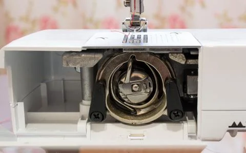Close up of a bobbin inside of a sewing machine Foto stock
