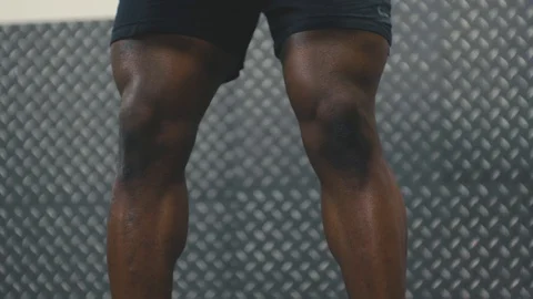 Close up of body builder doing bent over rows with Olympic bar in the gym Stock Footage 89502048