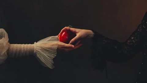 Close up body part unrecognizable person fantasy fairy woman holding ripe red Stock Footage 335811188