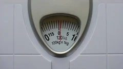 Close-up of a Scale Indicating the Weight of 120 Kg Stock Image