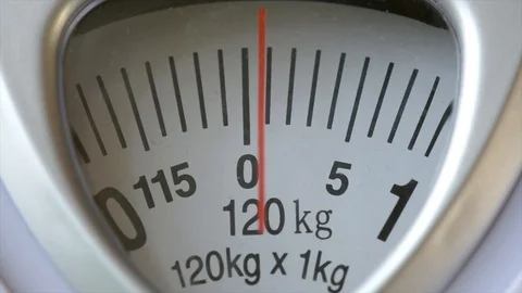 Close-up of a Scale Indicating the Weight of 120 Kg Stock Image