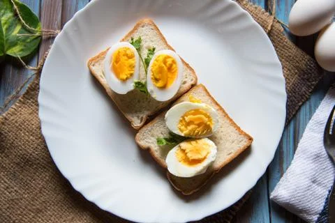 Close up of boiled eggs on bread slice Stock Photos