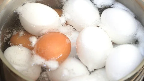 Close up on boiling eggs Stock Footage 95967709