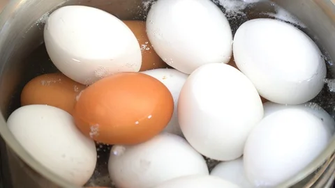 Close up on boiling eggs Stock Footage 95967715