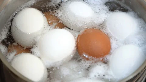 Close up on boiling eggs Stock Footage 95967753