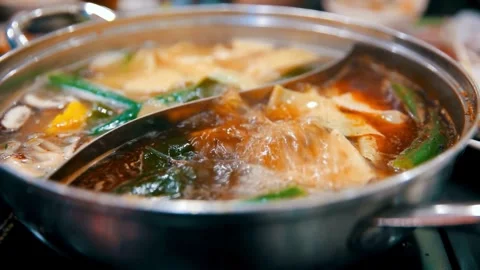 Close-up of Boiling Hot Pot with Various Ingredients Stock Footage 309546845