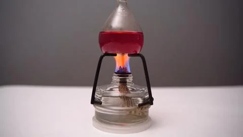 Close-up boiling liquid in a flask in the laboratory. Heated flask Stock Photos