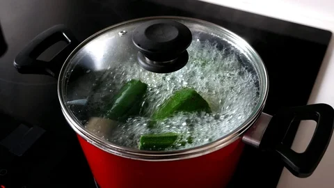 Close up of a boiling red pot of vegetables. Healthy food concept. Stock Footage 127928084