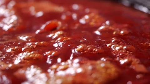 Close-up of boiling red tomato sauce in slow motion for making pizza or pasta Stock Footage 139077289