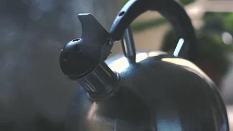 Close-up of a boiling spout whistling Stock Footage 154976627