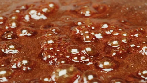 Close up of boiling sugar with bubbles turns into caramel, caramelization, chef 스톡 동영상 243668745