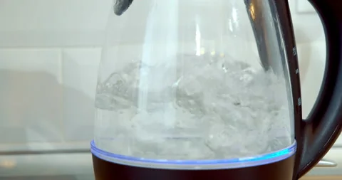 Close-up of boiling water in an electric kettle in the kitchen. Stock Footage 131626765