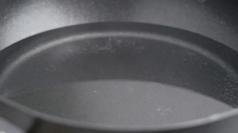 Close-up of Boiling water in a saucepan. Bubbles of steam inside boiling water. Stock Footage 140253737