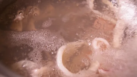 Close up of boiling water with squid cut into rings Stock Footage 122942531