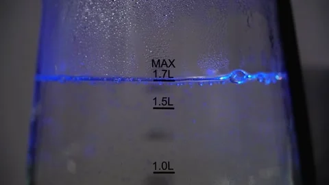 Close-up of boiling water transparent kettle on kitchen Stock Footage 165931997