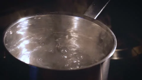 Close up of boiling water. Water boiling in steel pot. Catering concept, working Stock Footage 143247250