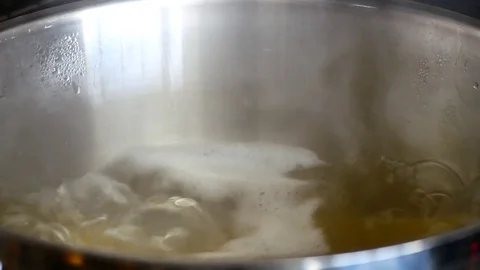 Close up boiling water  while high-temperature. Video stock 79609578
