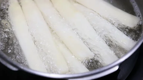 Close up of boiling white asparagus. Hand held camera. Stock Footage 196220729