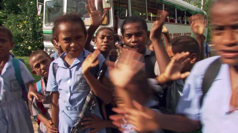 Close-up of boisterous Fijian children waving Stock Footage 59257252