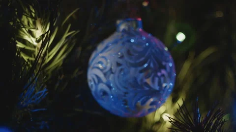 Close-up bokeh of Christmas tree decorations. Video stock 260870012