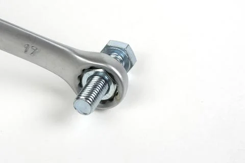 Close-up of bolt with nut and tool Stock Photos