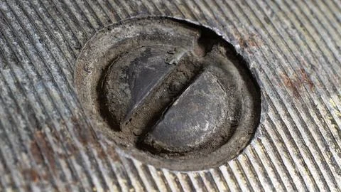 Close up of a bolt with a rusty screw. the adjusting bolt of the generator of Stock Photos