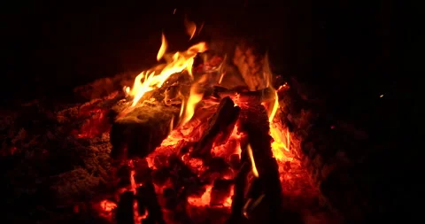 Close-up, a bonfire is burning, a flame of fire. Logs burn in fire, bonfire at Video stock 144644550