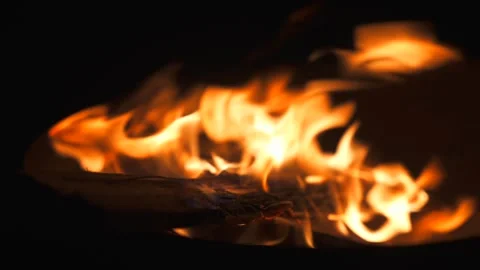 Close up bonfire flame from dry firewoods burning at night. Camping dinner Stock Footage 253420452