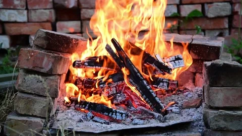 Close up bonfire flames of camping fire. brazier for a barbecue made of bricks. Video stock 138958769