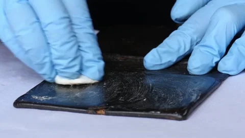 Close-up of book cover being cleaned book restoration Stock Footage 152176680