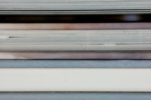 Close-up of a the book edge of three colored books Stock Photos