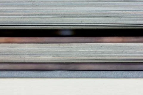 Close-up of a the book edge of three colored books Stock Photos