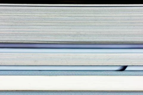 Close-up of a the book edge of three colored books Stock Photos