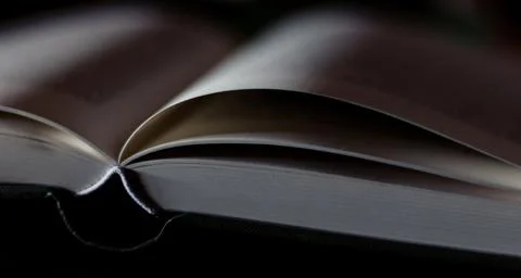 Close up book on table and dark background Stock Photos