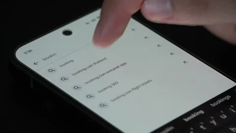Close up of booking.com application install page on smartphone screen Stock Footage 340053570