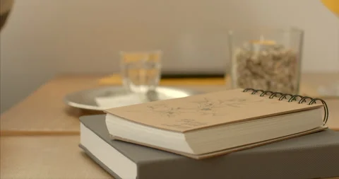 Close-up of books resting on table in cafe. Intellectual exploration relaxation. Stock Footage 260089790