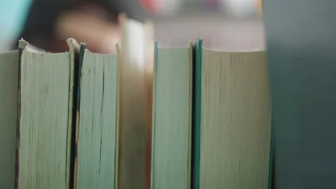 Close Up Books On Shelf With Hand Taking One In Library Vidéo 318713068