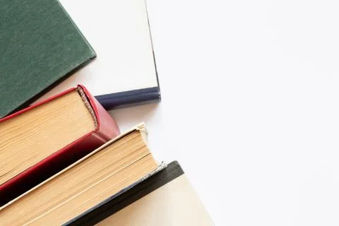 Close-up of books on a white background on the theme of education, reading,.. Stock Photos