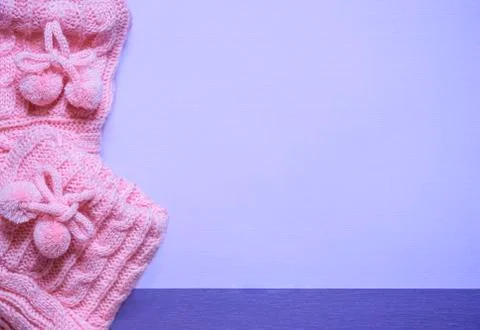 Close up with bootees on purple paper Stock Photos