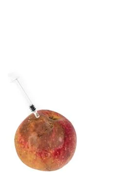 Close up Boring trace of a codling moth Cydia Pomonella, in a wormy apple. On Stock Photos