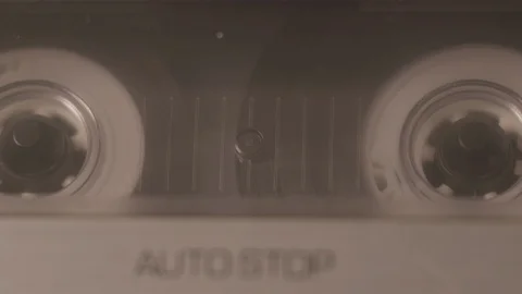 Close Up of Both Spools Playing on Cassette Tape Deck Stock Footage 119017060