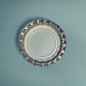 Close up of a bottle cap on gray background with clipping path. Toned. Stock Photos