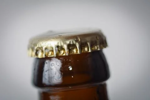Close-Up of Bottle with Crown Cap and Water Droplets Stock Photos