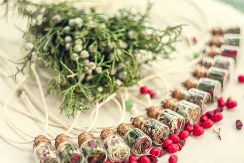 Close up bottle pendants with aromatic herbs concept photo Stock Photos