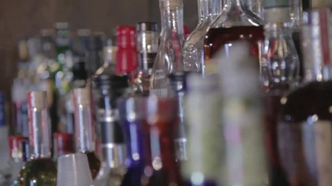 Close Up of Bottles and Glasses in Bar Stock Footage
