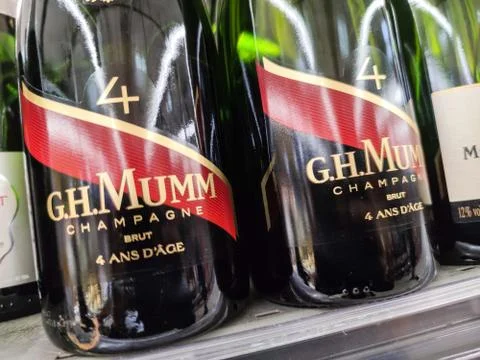 Close-up on bottles of G.H. Mumm brand champagnes from the shelf of a superma Stock Photos
