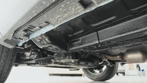 Close-up of the bottom of the car. Beneath the Carriage, A Glimpse of Stock Footage 257766189