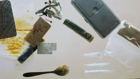 Close-up bottom view of junkie in sunglasses snorting mdma powder with rolled Stock Footage 107403199